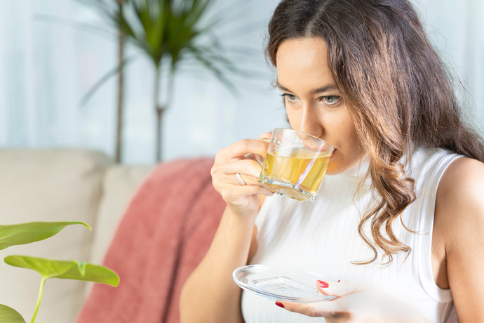 Woman enjoying the benefits of green tea.